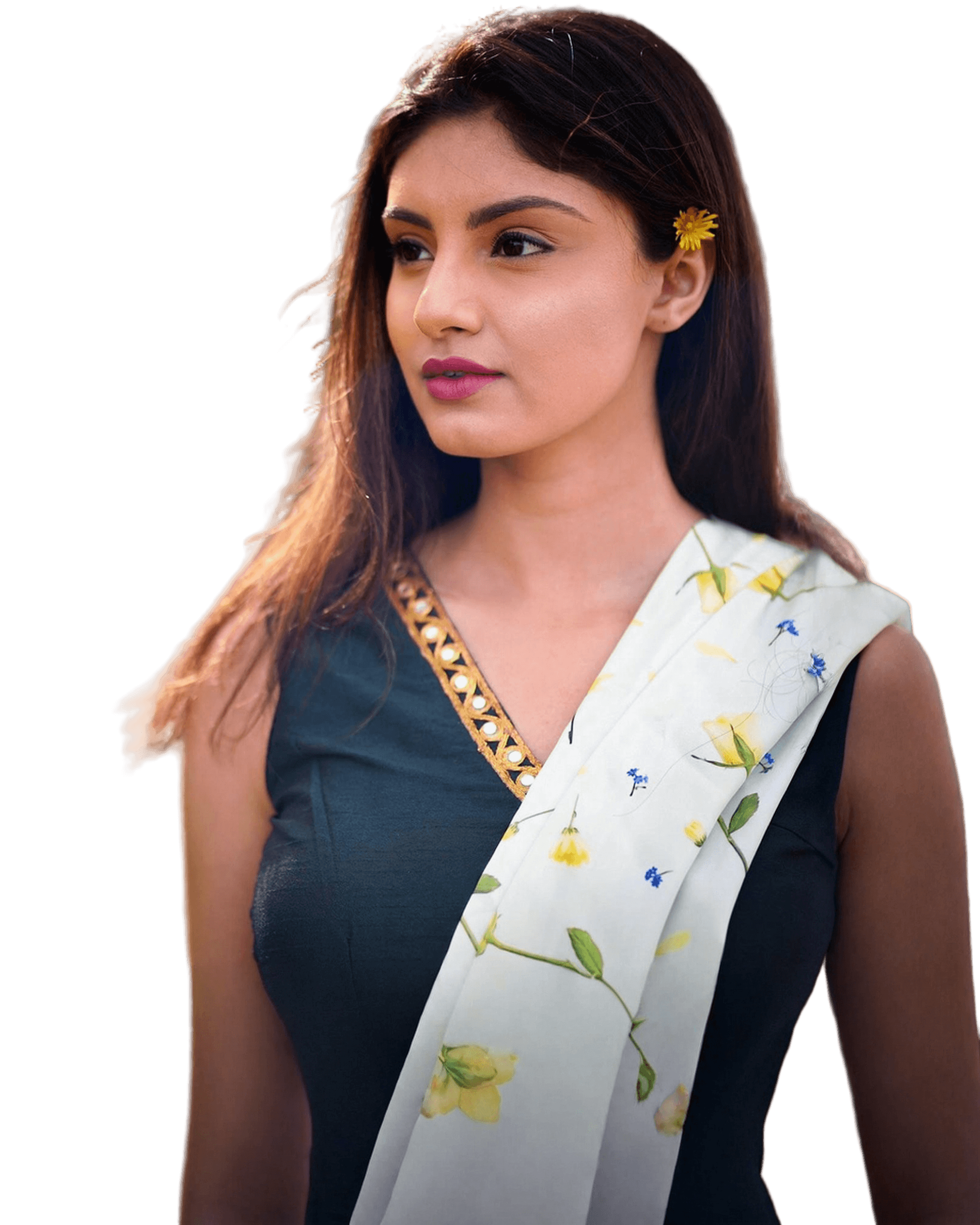 Sarina Agarwal, portrait in a deep green dress with a yellow flower in her hair